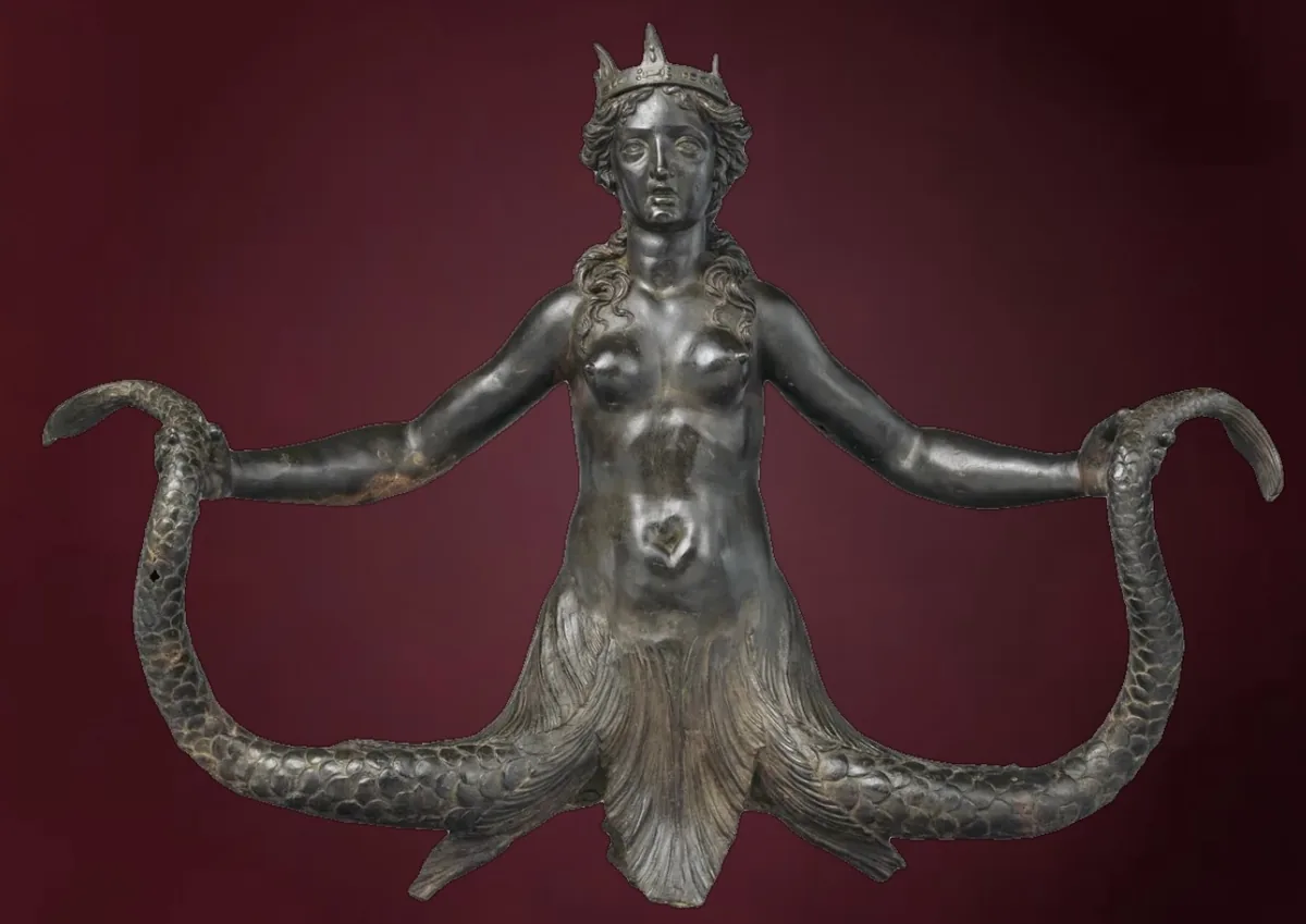 A bronze siren with a crown and a forked fish tail