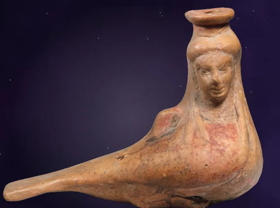 A clay vessel shaped as a bird with a woman's face
